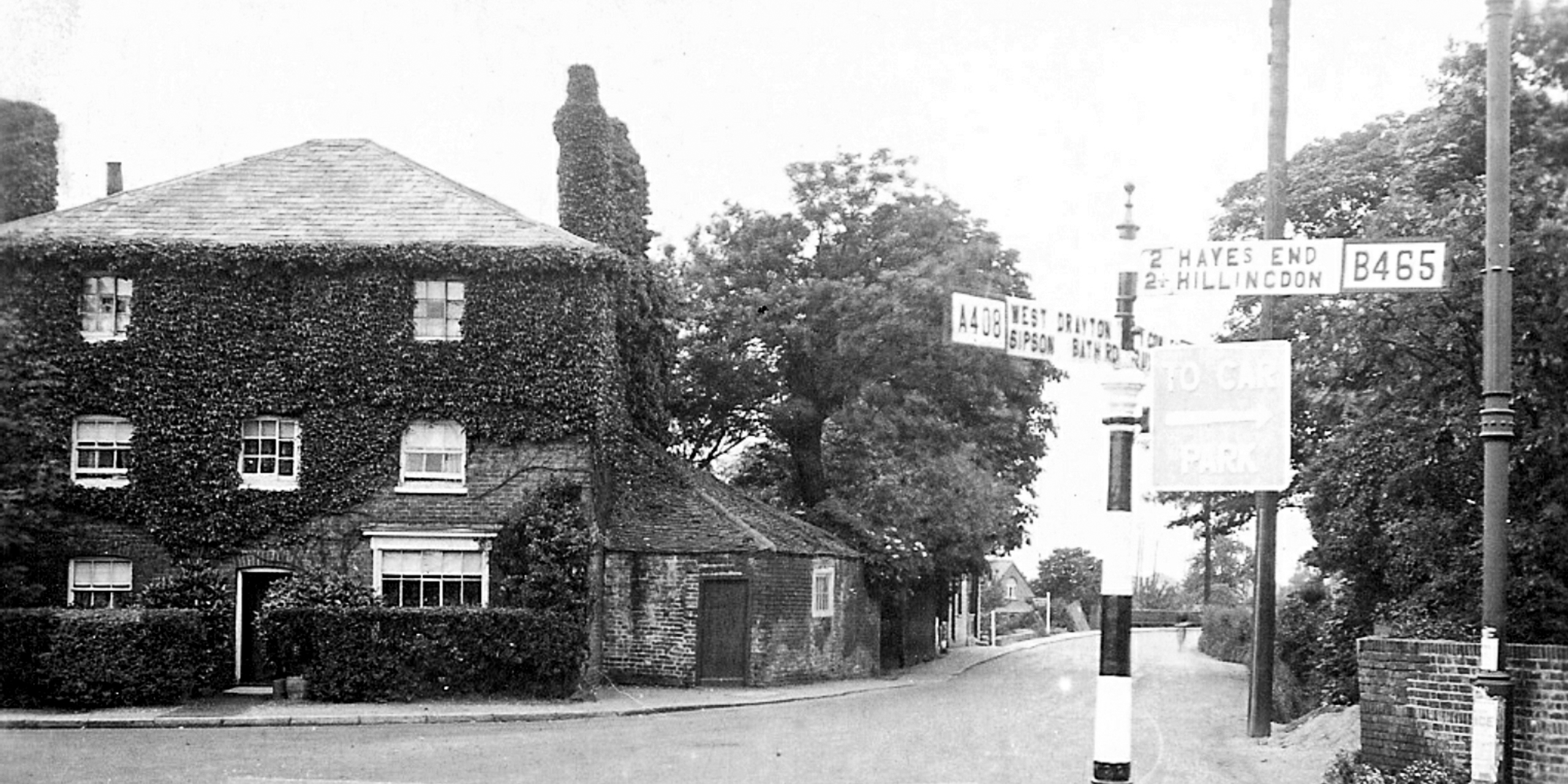 Now & Then - Junction of High Street and Falling Lane, Yiewsley - 2019 vs c.1920